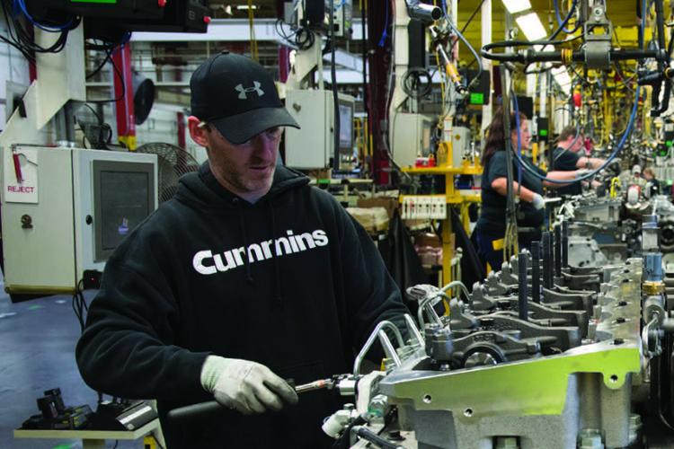 Man and woman working in manufacturing plant